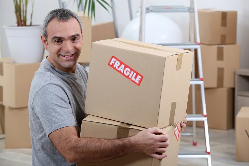 Removal van and moving team in a Pimlico residential street