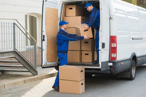 Packed boxes and furniture ready for a house move in Pimlico