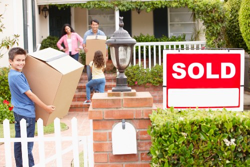 Packed office boxes and furniture ready for transport in a central London property